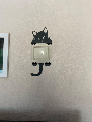 Наклейка на стену "Котик для розетки"